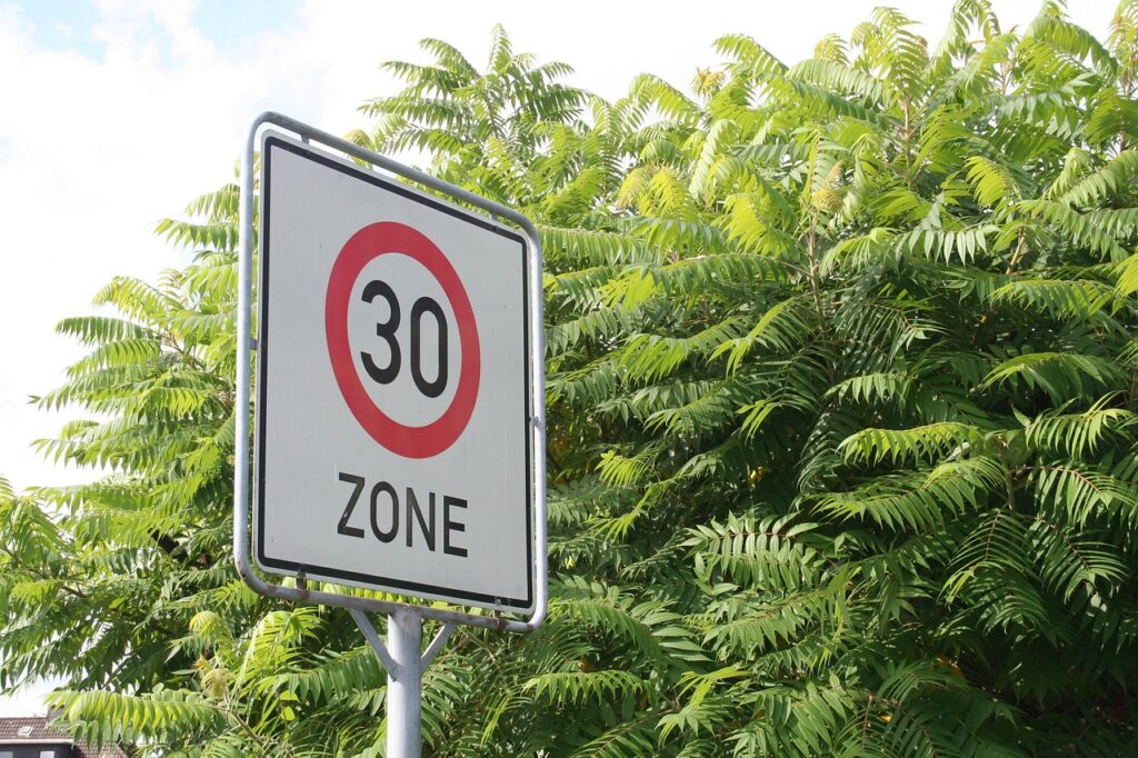 A speed limit sign displaying 30, representing a financial roadmap. This money guide for 30-somethings helps build wealth, invest wisely, and secure the future.